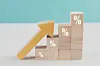 Wooden blocks with percentage sign and arrow up, financial growth, interest rate increase, inflation concept