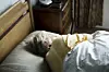 Elderly caucasian woman sleeping on the bed