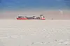 Winter shipping. Big cargo ship in frozen ice sea fairway